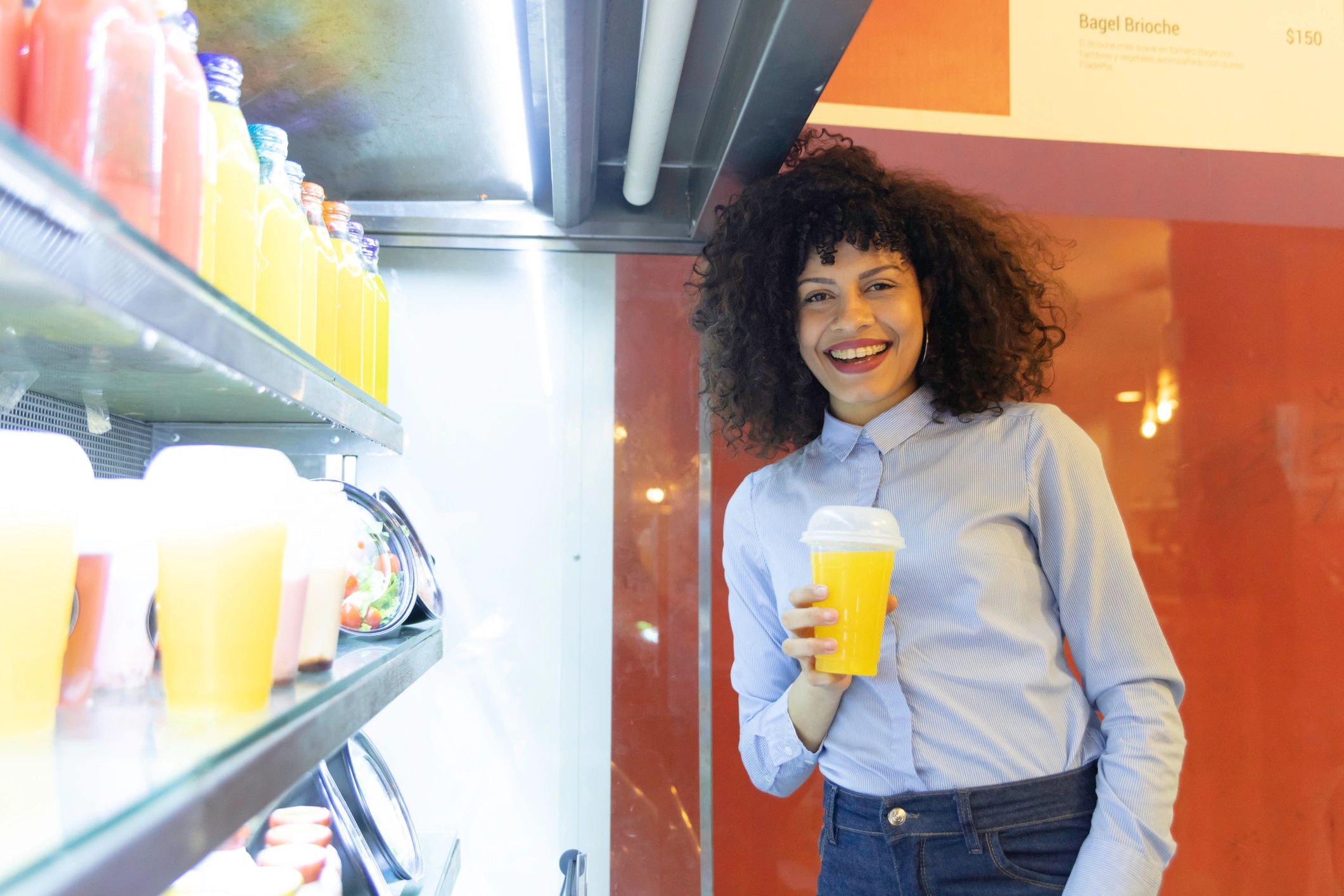 happy business owner with vending machine