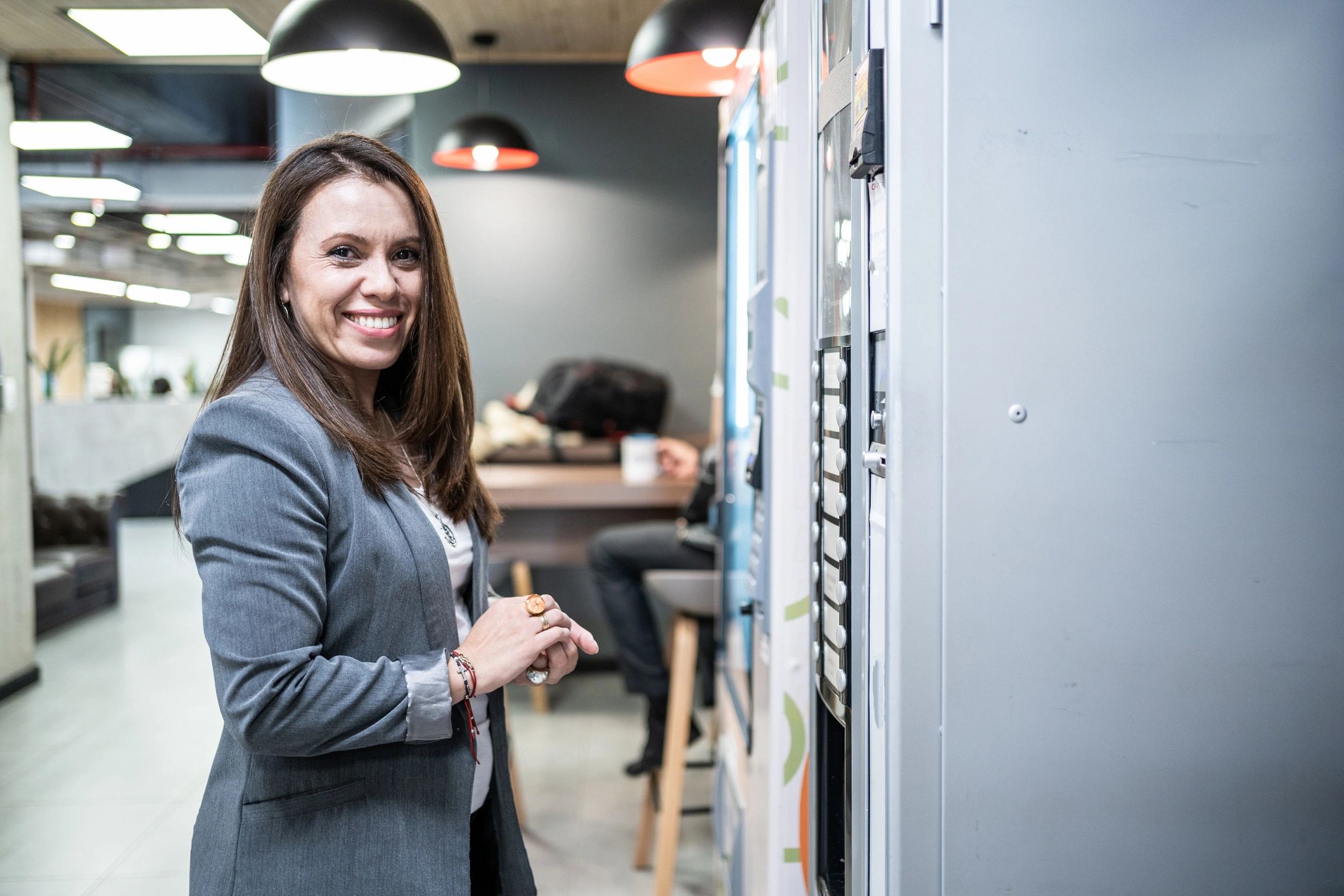 happy business owner with vending machine